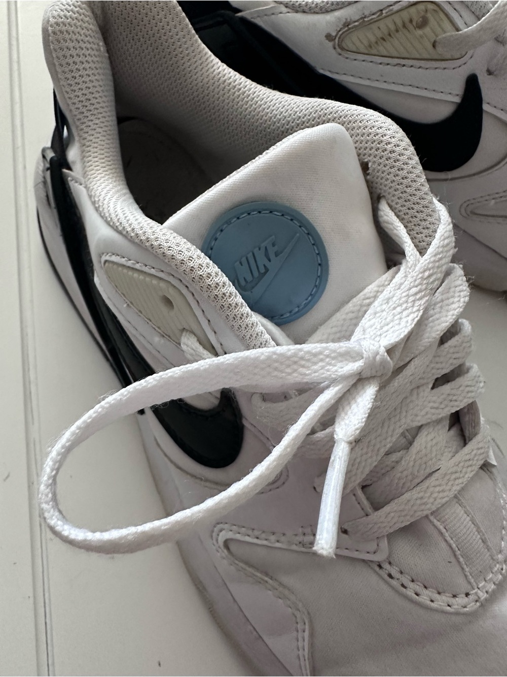 Nike White Sneakers with Black Swoosh Accent - Picture 2 of 5